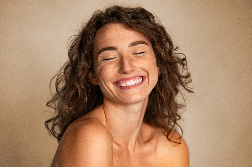 Natural beauty woman laughing with joy
